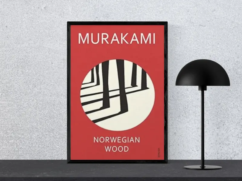 Norwegian Wood by Haruki Murakami Book cover of Norwegian Wood by Haruki Murakami, displayed in a black frame next to a modern black lamp, highlighting one of the good books to read fiction.