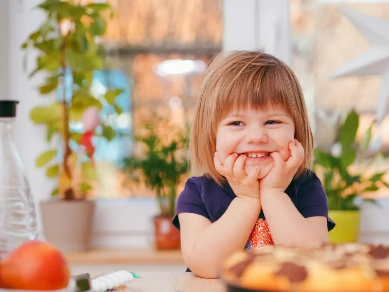 A beautiful kid is smiling and living his a happy life